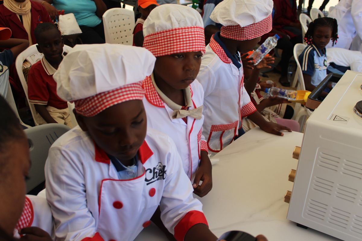 Cooking Club students in chef uniforms